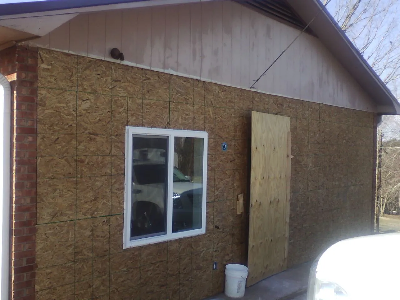 OSB sheathing on a garage addition wall before siding in Kings Mountain